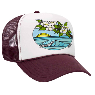 A maroon trucker hat featuring a sunrise with rolling waves and plumeria flowers by Hawaii surf artist Heather Brown