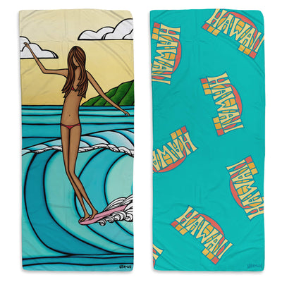 a microfiber towel featuring a woman surfing the epic waves of Hawaii by Hawaii surf artist Heather Brown