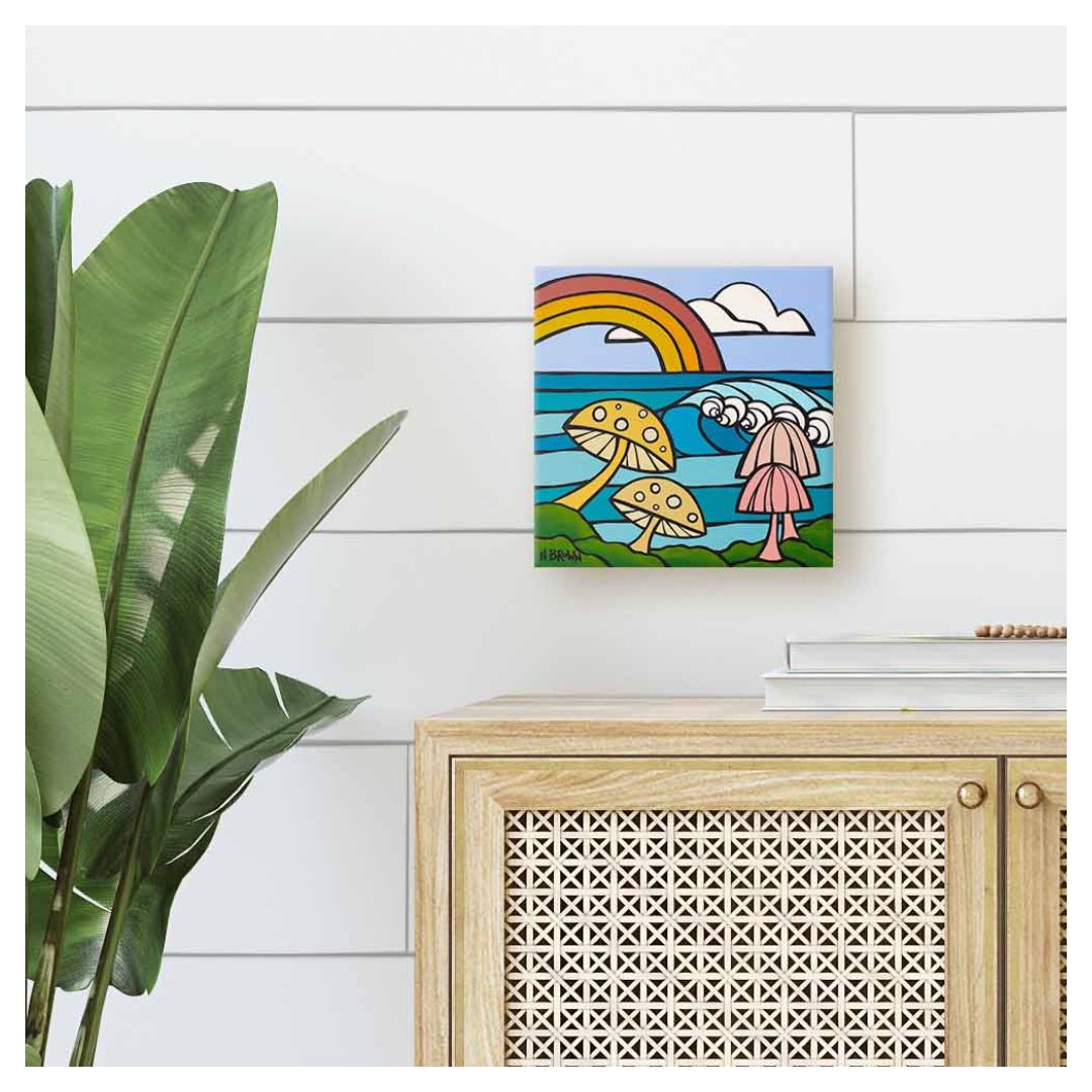 Tropical mushroom canvas wall art by Hawaii artist Heather Brown, with colorful shrooms and a rainbow over the ocean.