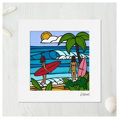 Matted art print by Hawaii artist Heather Brown featuring two female Hawaii surfers with red and pink surfboards checking out waves on the beach 