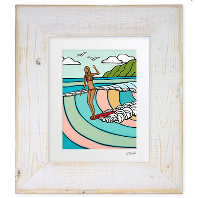 White framed matted art print by Hawaii artist Heather Brown featuring a surf girl on a red longboard riding a pastel colored wave.