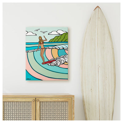 Canvas art print by Hawaii artist Heather Brown featuring a surf girl on a red longboard riding a pastel colored wave beach decor