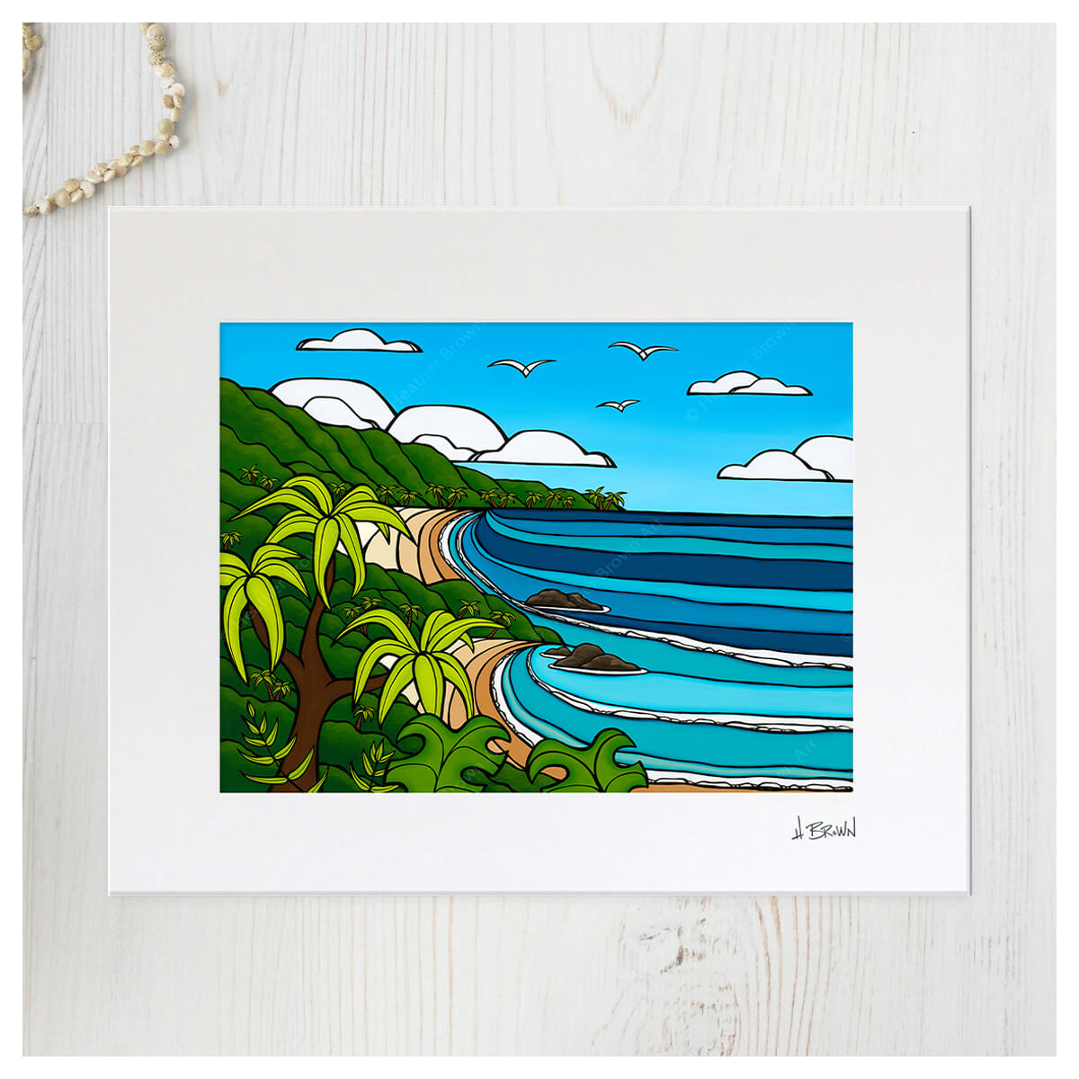 matted tropical seascape art print of outer island paradise by Kauai artist Heather Brown - flatlay with seashells