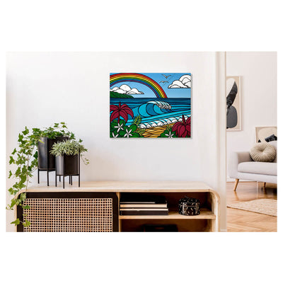 A metal art print featuring a peaceful scene that is created with large breaking waves, tropical flowers, and a beautiful rainbow by Hawaii surf artist Heather Brown