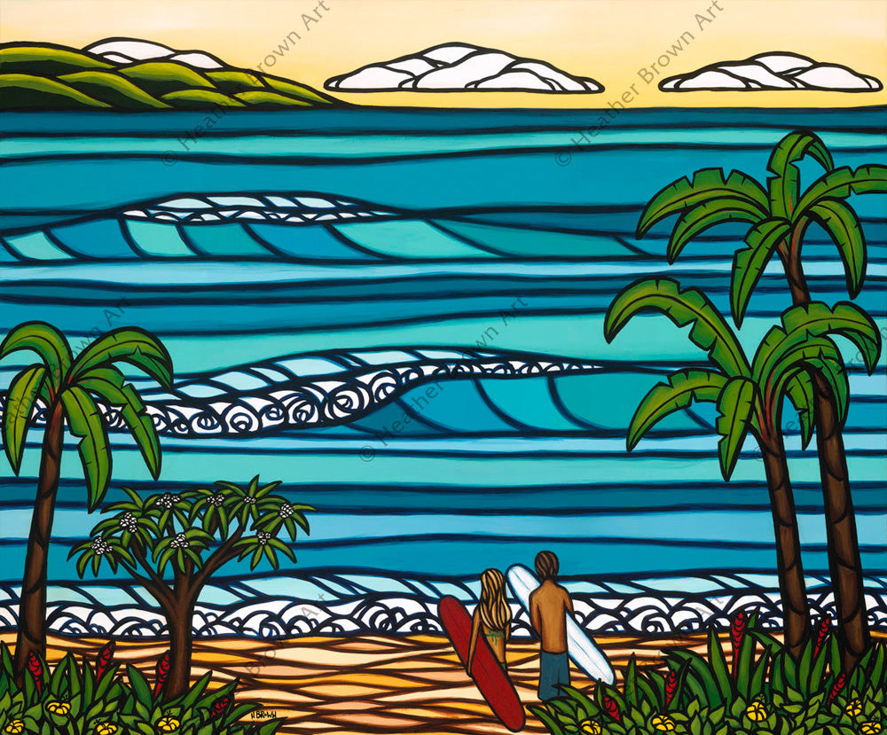 Two surfers watch the rolling Hawaiian waves from the shore of a Hawaiian paradise