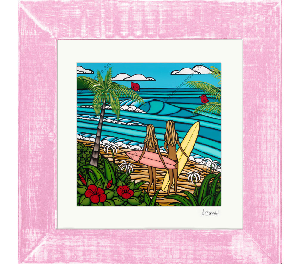 Framed and matted print of Surf Sisters, showing surf girls, the warm beach and blue ocean.