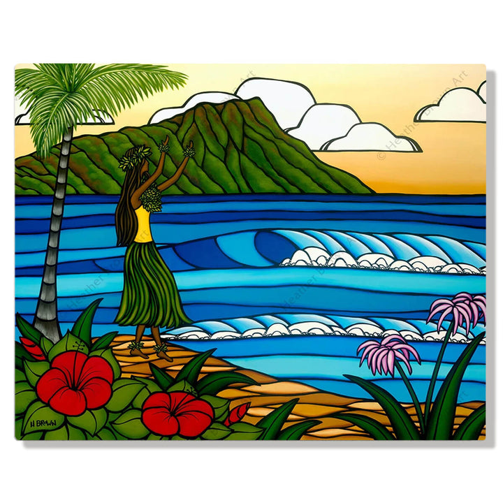 A metal art print featuring a Hawaiian hula girl dancing on the beach with a backdrop of Diamond Head Crater, crashing blue waves, palm trees, tropical red flowers, & a sunset yellow sky by Hawaii surf artist Heather Brown