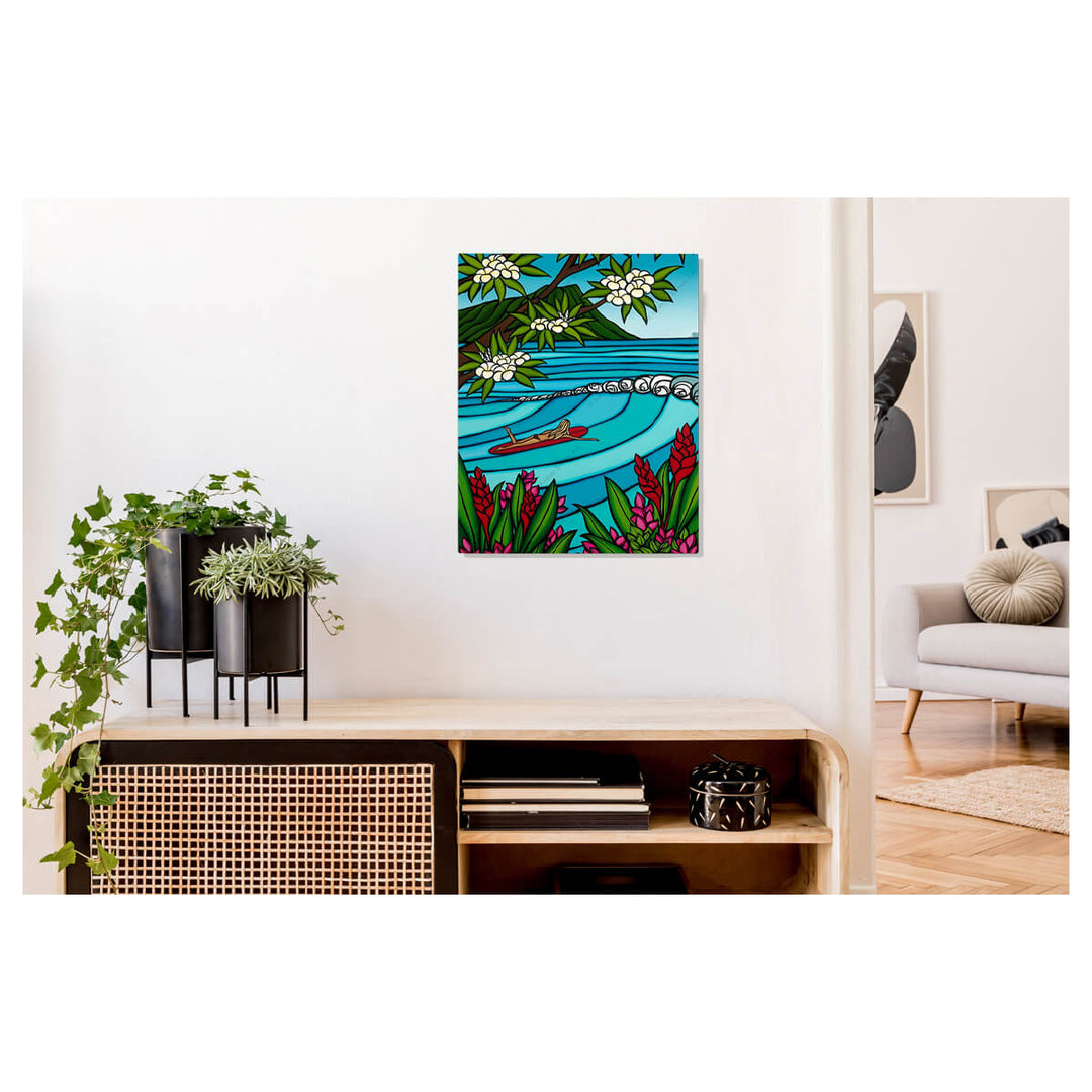 A metal art print featuring tropical flowers, Diamond Head landscape, and a surfer girl is heading out on the gorgeous blue Waikiki Beach waves by Hawaii artist Heather Brown