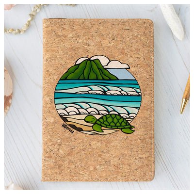 This "Honu Smile" cork journal features a smiling turtle, rolling waves, and the Diamond Head Crater by Hawaii surf artist Heather Brown