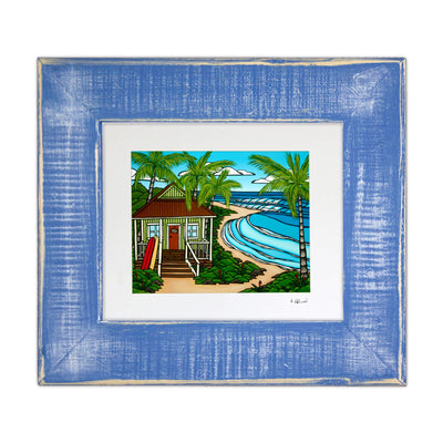 A framed matted art print featuring a dream Hawaii beach surf bungalow with perfect waves breaking in the backyard by Hawaii surf artist Heather Brown