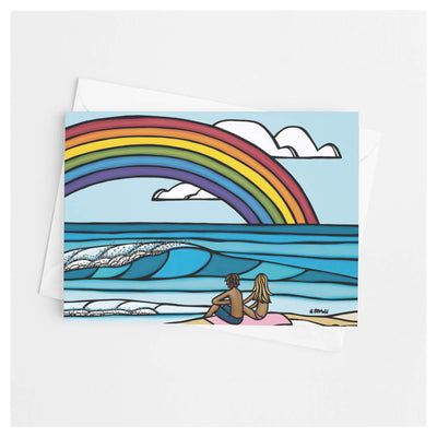 A rainbow framing a ocean and the couple on the shore by Hawaii surf artist Heather Brown