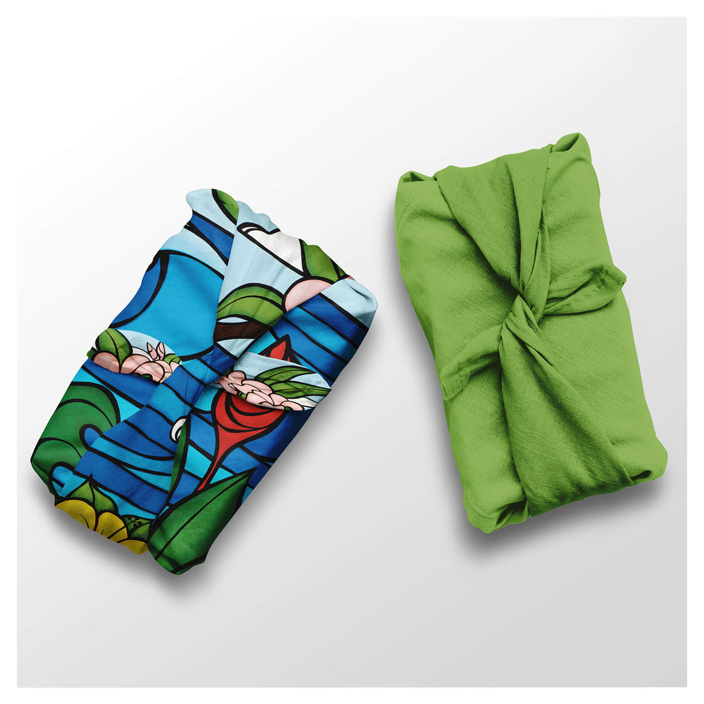 Seacape with vibrant colored tropical flowers and a solid green colored furoshiki cloths by Hawaii surf artist Heather Brown