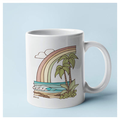 A white mug with a beautiful pastel colored seascape by Hawaii surf artist Heather Brown