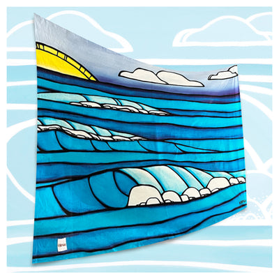 A sarong featuring a vast ocean view with blue rolling waves and a sun setting on the horizon by Hawaii surf artist Heather Brown
