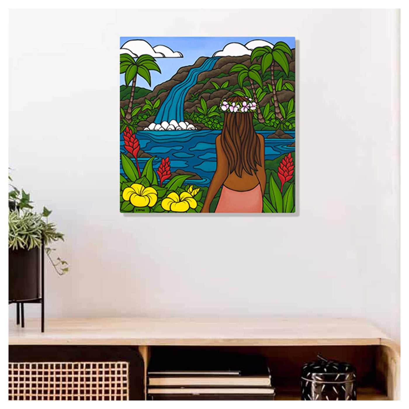 A metal art print of a local woman enjoying the waterfall view with colorful tropical flowers surrounding her by Hawaii surf artist Heather Brown